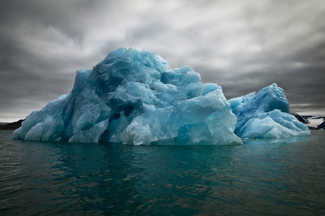 The Last Iceberg Series III: Blue Underside Revealed II, Svalbard, July 5, 2010 (photo © Camille Seaman)