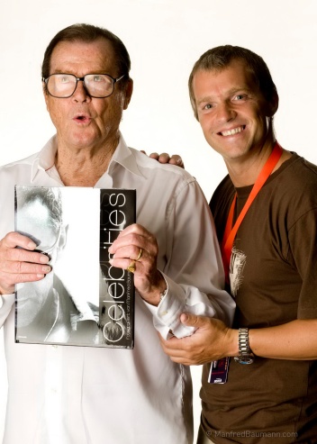 Manfred Baumann with the late actor Sir Roger Moore (photo courtesy of Manfred Baumann)