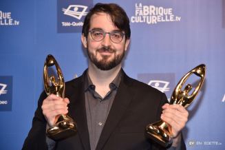 Richard-Hamelin in 2019 holding 2 Félix awards he won that year (photo courtesy of Charles Richard-Hamelin)